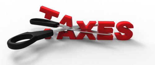 stock-photo-cutting-taxes-with-a-scissor-cutting-taxes-341284121